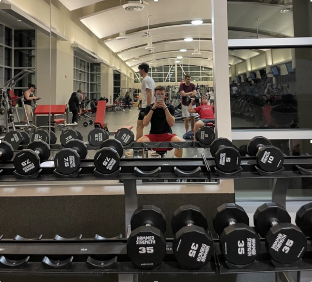 Man at gym near weights.