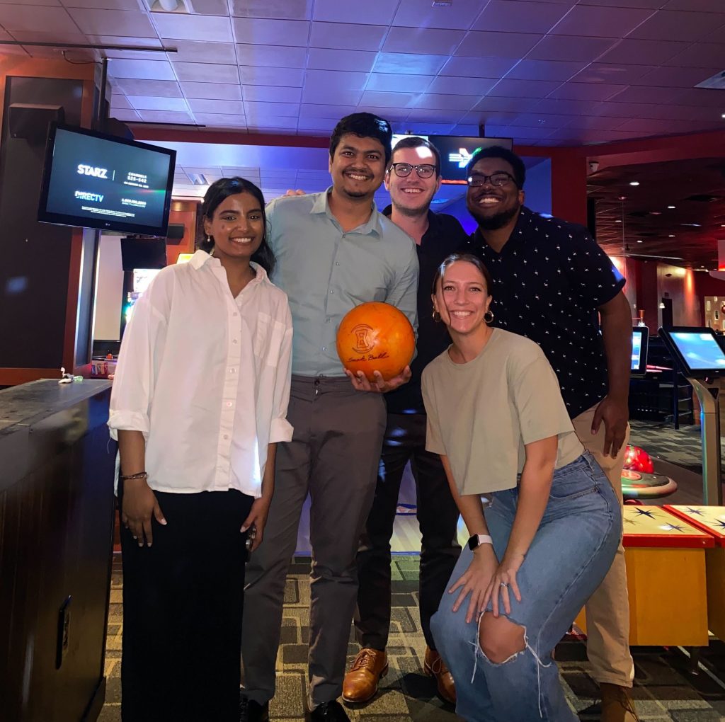 Five students at a bowling alley