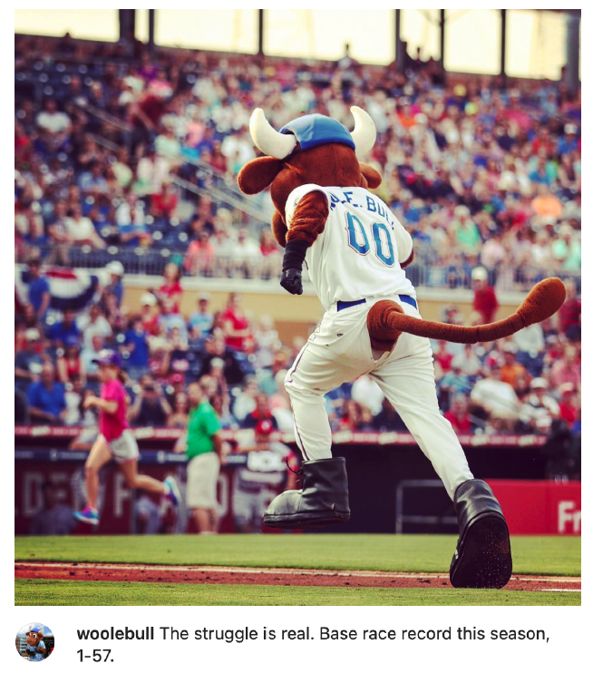 Image of sports mascot running the bases during a baseball game. Caption reads: Woolebull The struggles is real. Base race record this season, 1-57.