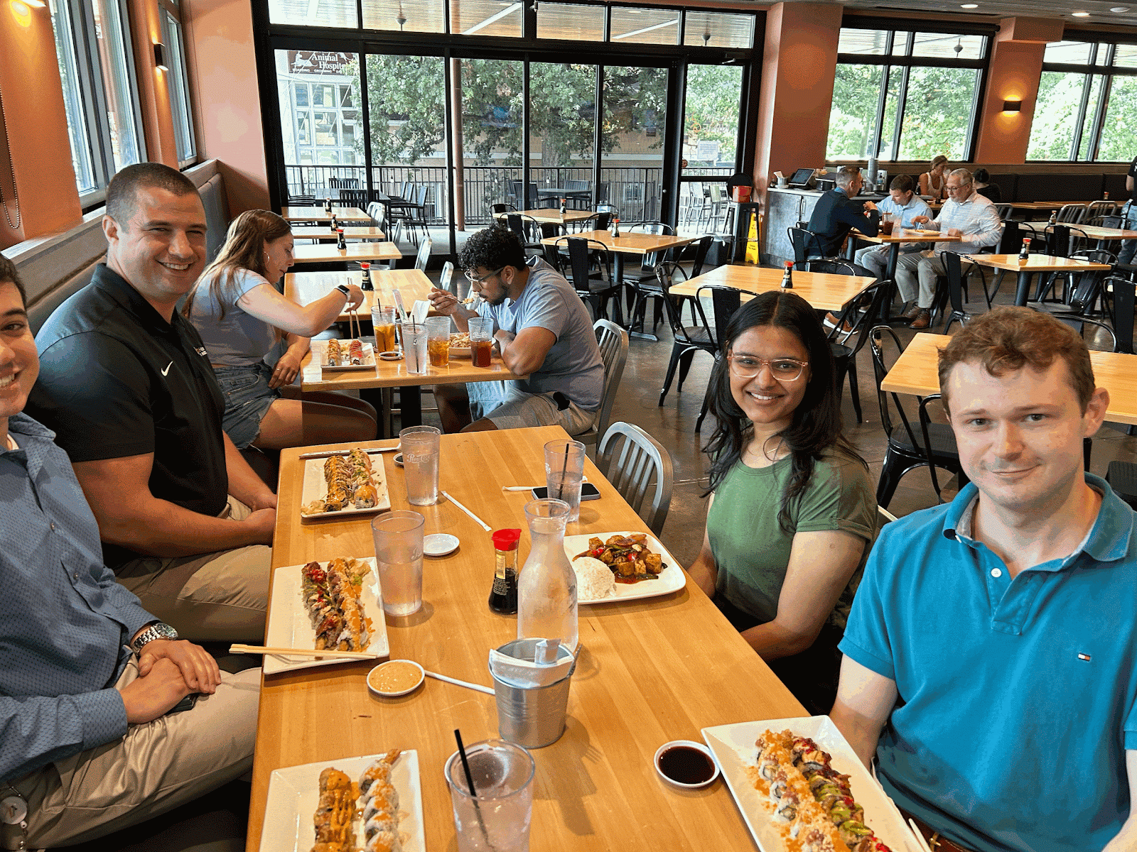 Group of students eating sushi