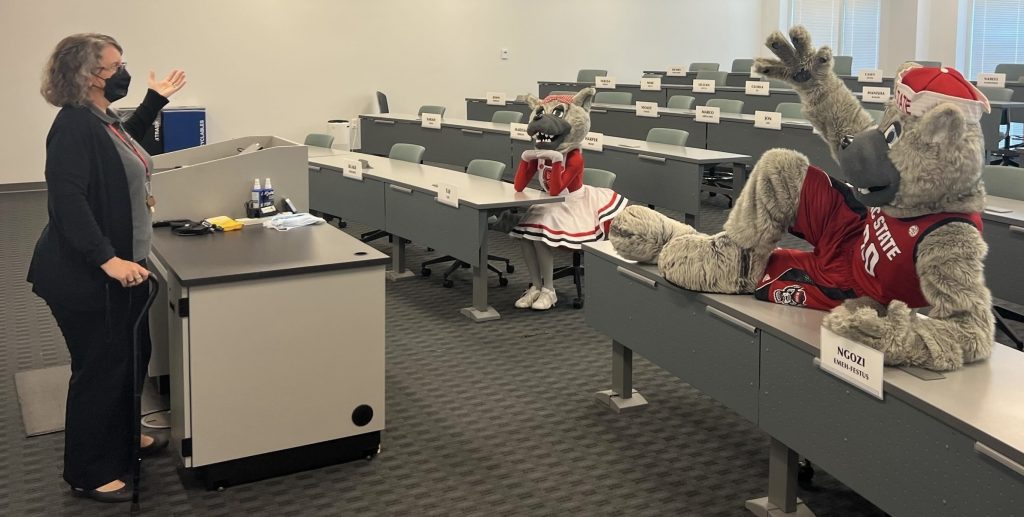 Dr. SEW "teaching" Ms Wuf and Mr Wuf, NC State mascots