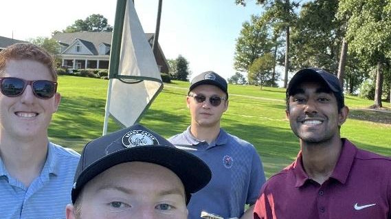 Four men golfing